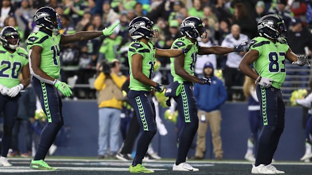 The Seattle Seahawks celebrate after a 60 yard touchdown by David Moore