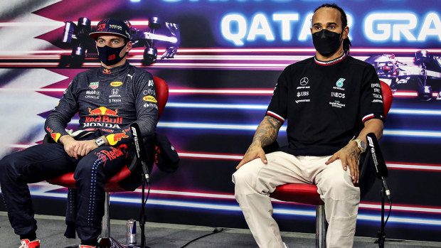 Lewis Hamilton and Max Verstappen talk in a press conference