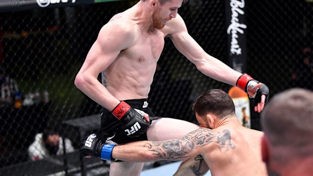 Cory Sandhagen lands a flying knee to knock out Frankie Edgar in their bantamweight fight during the UFC Fight Night event at UFC APEX on February 06, 2021 in Las Vegas, Nevada