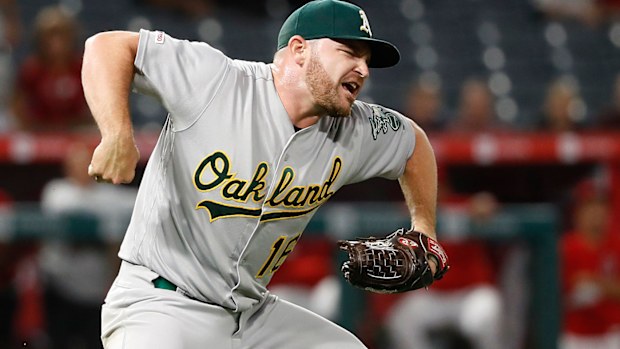 Liam Hendriks #16 of the Oakland Athletics reacts getting Kevan Smith #44 of the Los Angeles Angels of Anaheim to ground out and end a game