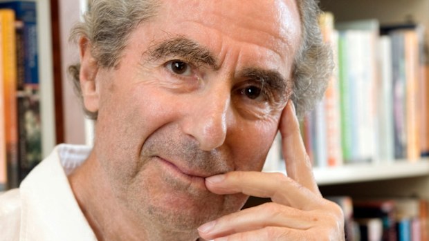 Philip Roth poses for a photo in the offices of his publisher Houghton Mifflin, in New York.