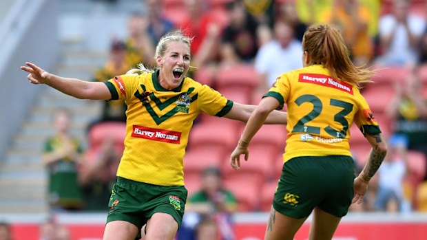 Ali Brigginshaw celebrates with a Jillaroos teammate.