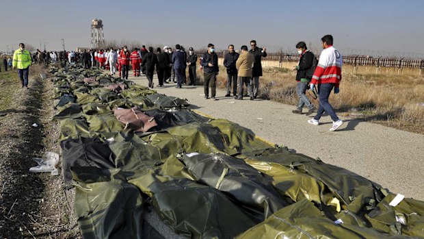 Bodies of the victims of a Ukrainian plane crash are collected by rescue team at the scene of the crash in Shahedshahr, southwest of the capital Tehran, Iran.