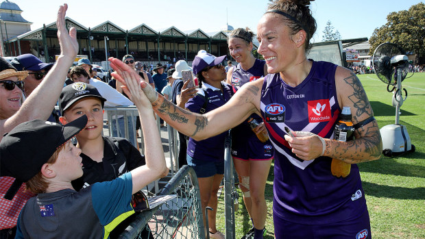 Mia-Rae Clifford of the Dockers greets fans after winning the Round 1 AFLW match