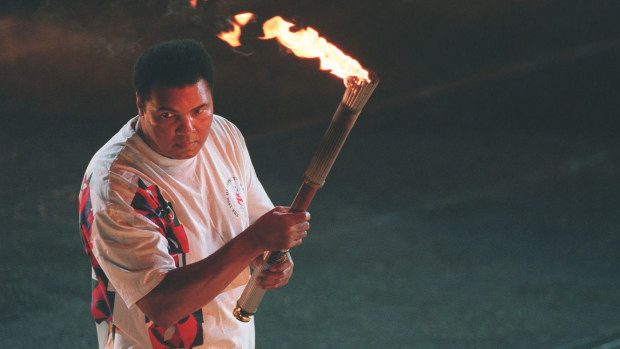 Muhammad Ali preparing to light the Olympic flame at Atlanta 1996.