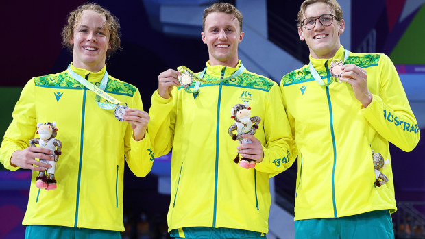 Elijah Winnington (centre), Sam Short (left) and Mack Horton (right) after finishing 1-2-3 in the 400m freestyle at the 2022 Commonwealth Games.