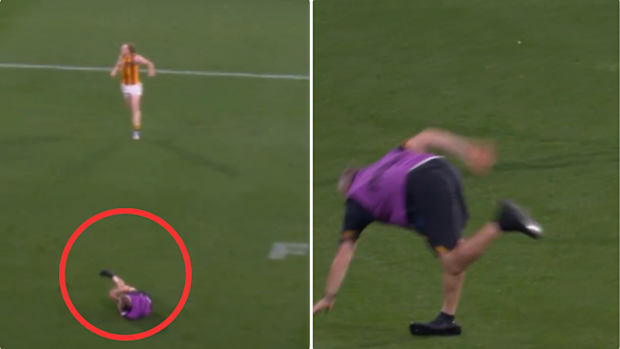 Hawthorn physio Andrew Lambert trips not once, but twice.