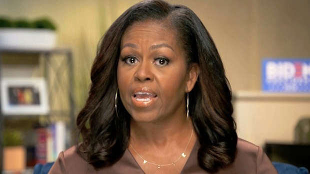 Michelle Obama wore a gold necklace with the letters V-O-T-E -- while giving her Democratic National Convention speech.