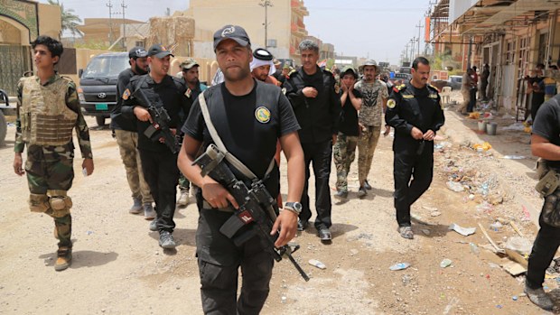 Iraqi security forces patrol in Fallujah, Iraq. (AAP)