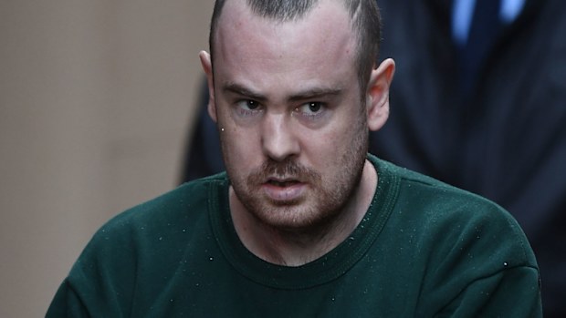 Nathan Connors is escorted to a Corrective Service van.