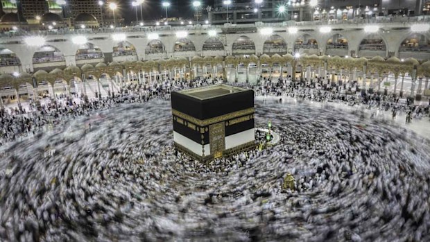 Muslim worshippers praying around the holy Kaaba at the Grand Mosque in Mecca. (AAP)