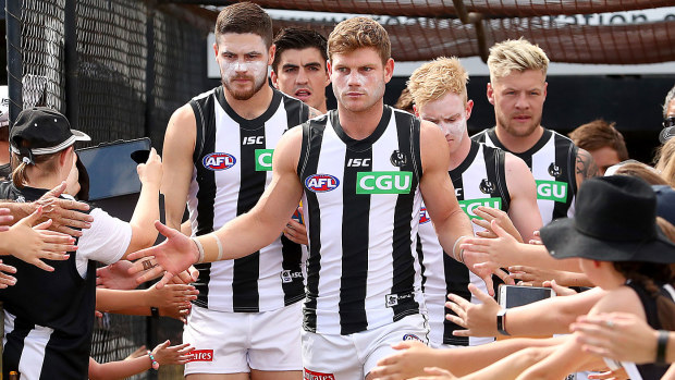 Taylor Adams of the Magpies runs out during the 2020 AFL Marsh Community Series 