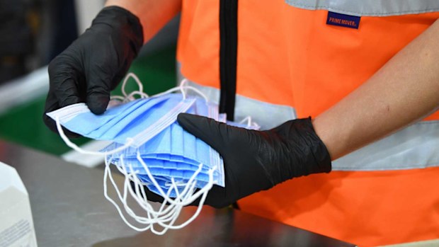 Close up of face masks on the production line of the Detmold PPE production facility in Brompton, Adelaide.