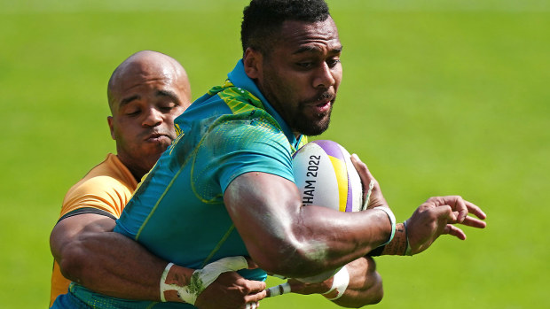 Australia's Samu Kerevi (right) is tackled by Jamaica's Dy'Neal Fessal during the Men's Pool D Rugby Sevens match at Coventry Stadium on day one of the 2022 Commonwealth Games