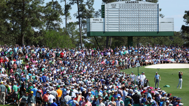 Huge crowds watch Tiger Woods practice at Augusta National.