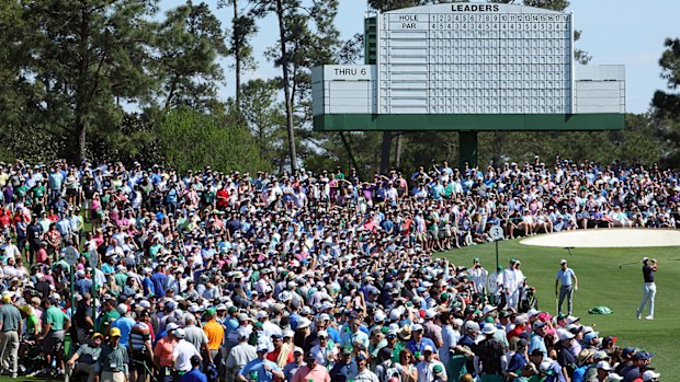 Huge crowds watch Tiger Woods practice at Augusta National.