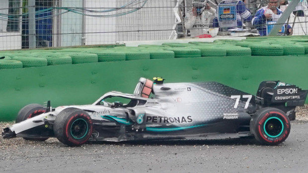 The Mercedes of Valtteri Bottas lies abandoned after he crashed out of the German Grand Prix.