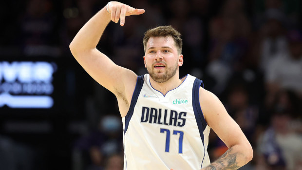 Luka Doncic celebrates after making a three-pointer in game seven