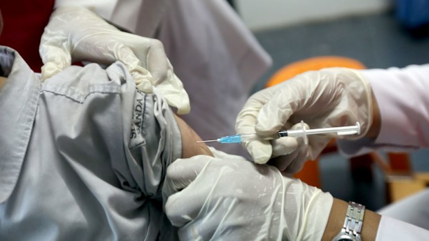 A file photograph shows an Indonesian school student being vaccinated against the Rubella virus at a school in Banda Aceh.