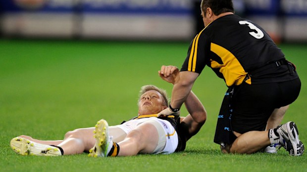 Richmond's Jack Riewoldt lands awkwardly after a mark in a 2011 match