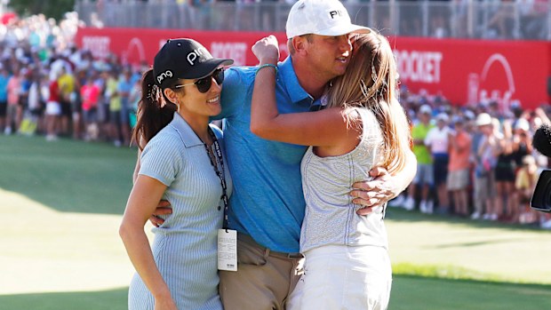 Nate Lashley hugs his girlfriend Ashlie Reed wearing black hat and his sister Brooke Lashley 