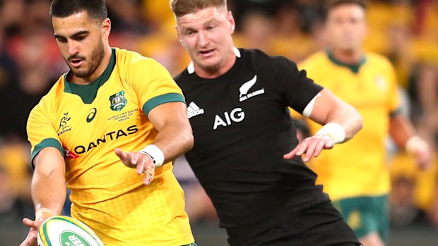 Tom Wright of the Wallabies kicks the ball 
