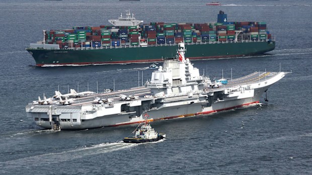The Liaoning, China's first aircraft carrier, sails into Hong Kong for a port call.