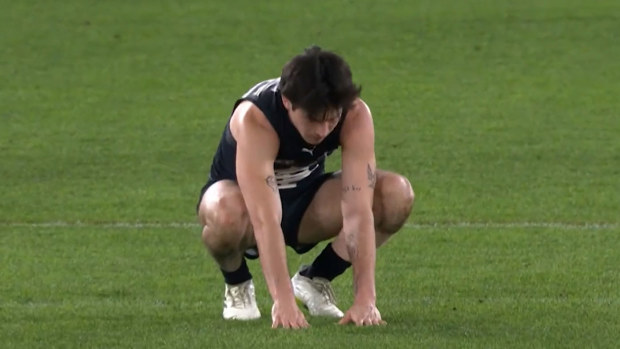 Carlton's Zac Fisher took several moments before getting back on his feet after being floored by Bedford's hit