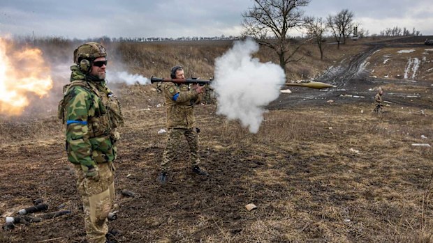 A Ukrainian soldier fires a rocket launcher in the Donbas region.