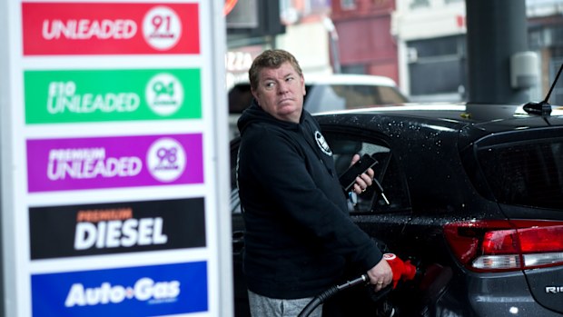 A Sydney motorist fills up his vehicle in Chippendale, in Sydney's inner west.