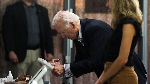 Joe Biden voting early with his granddaughter.