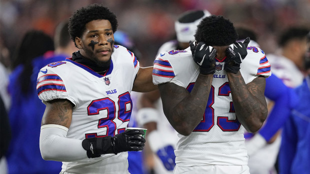 Cam Lewis and Siran Neal  of the Buffalo Bills react to teammate Damar Hamlin collapsing after making a tackle.