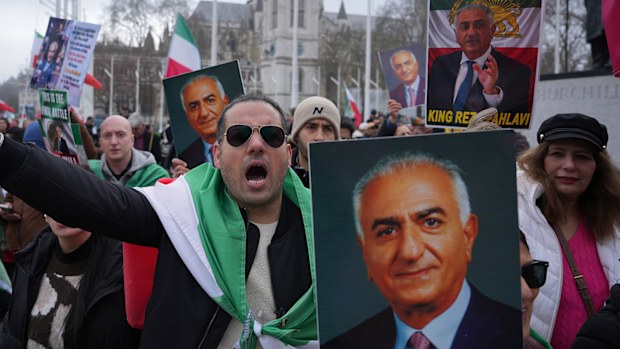 Protesters in London bear posters of Reza Pahlavi.