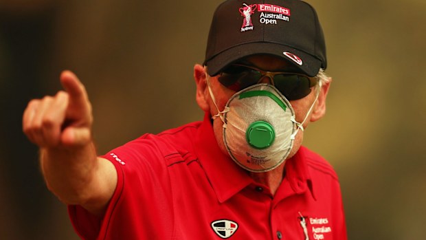 A course worker wears a face mask due to the smokey conditions