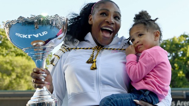 Serena Williams of the USA celebrates with daughter Alexis Olympia after winning the final match against Jessica Pegula
