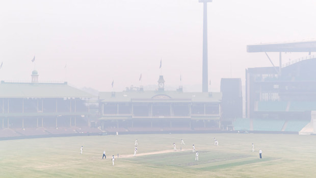 Smoke smothers the SCG during a Shield match