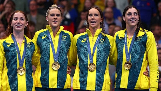 From left: Mollie O'Callaghan, Shayna Jack, Emma McKeon and Meg Harris sing the Australian national anthem after winning relay gold in Paris.
