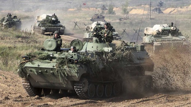 Belarusian army vehicles drive preparing for war games. (AAP)