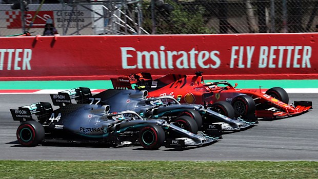 Lewis Hamilton (44), Valtteri Bottas (77) and Sebastian Vettel (5) at the first corner of the Spanish GP.
