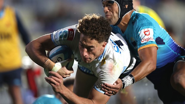 Mark Nawaqanitawase of the Waratahs scores a try