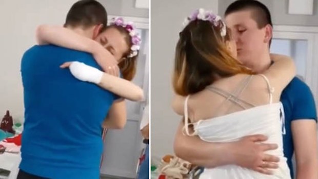 Oksana and Victor during their first dance after the bride lost both her legs on a Russian landmine in Lysychansk, Ukraine