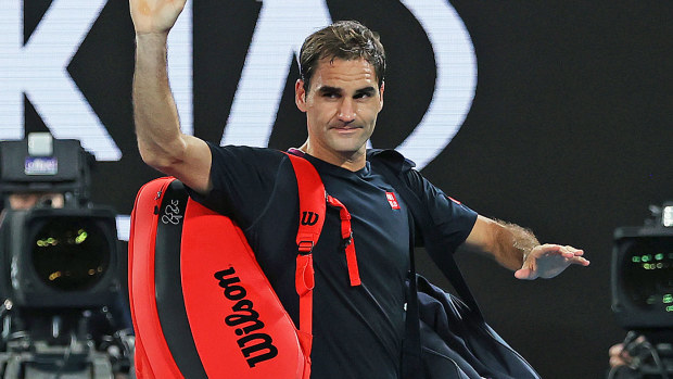 Roger Federer of Switzerland acknowledges the crowd as he walks off court after losing his Men's Singles Semifinal match against Novak Djokovic
