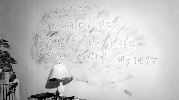 The message scrawled on the wall at the murder scene.