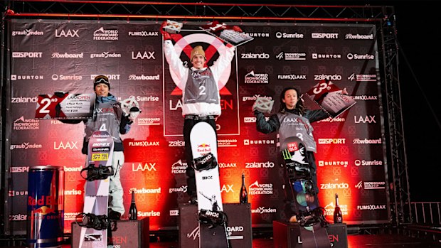 Scotty James (centre) standing atop the Laax Open podium.