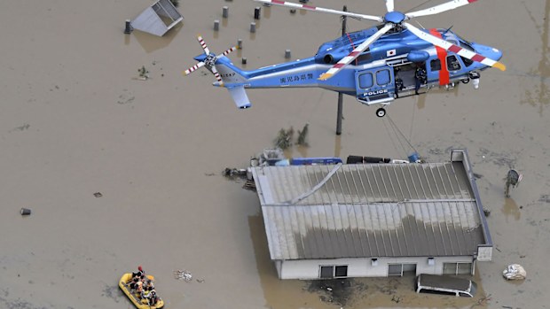 Rescue operation is conducted in a flooded area following a heavy rain in Hitoyoshi, Kumamoto prefecture, southern Japan Saturday, July 4, 2020. 