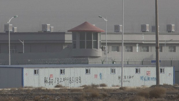 A guard tower and barbed wire fences