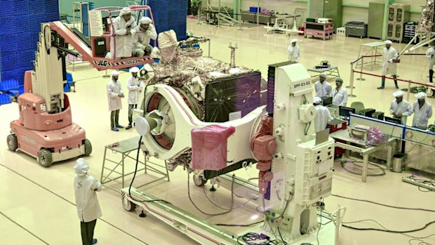 Scientists work on the orbiter vehicle of "Chandrayaan-2" for India's first moon lander and rover mission.