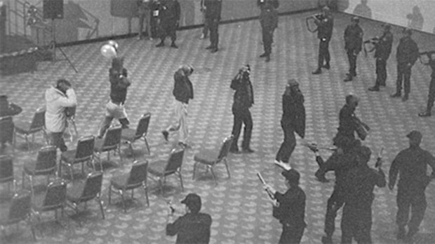 The wanted fugitives were led into an auditorium before being arrested.