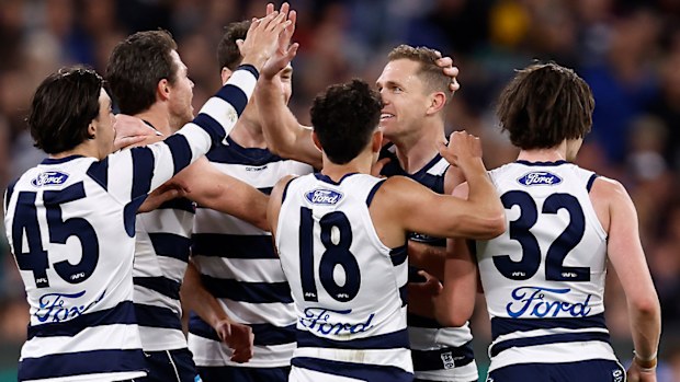 Geelong players celebrate a goal with captain Joel Selwood in the preliminary final