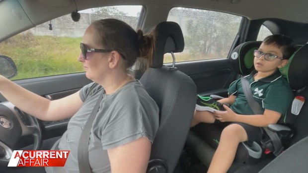 Leanne Collins driving her son Brodie to school.